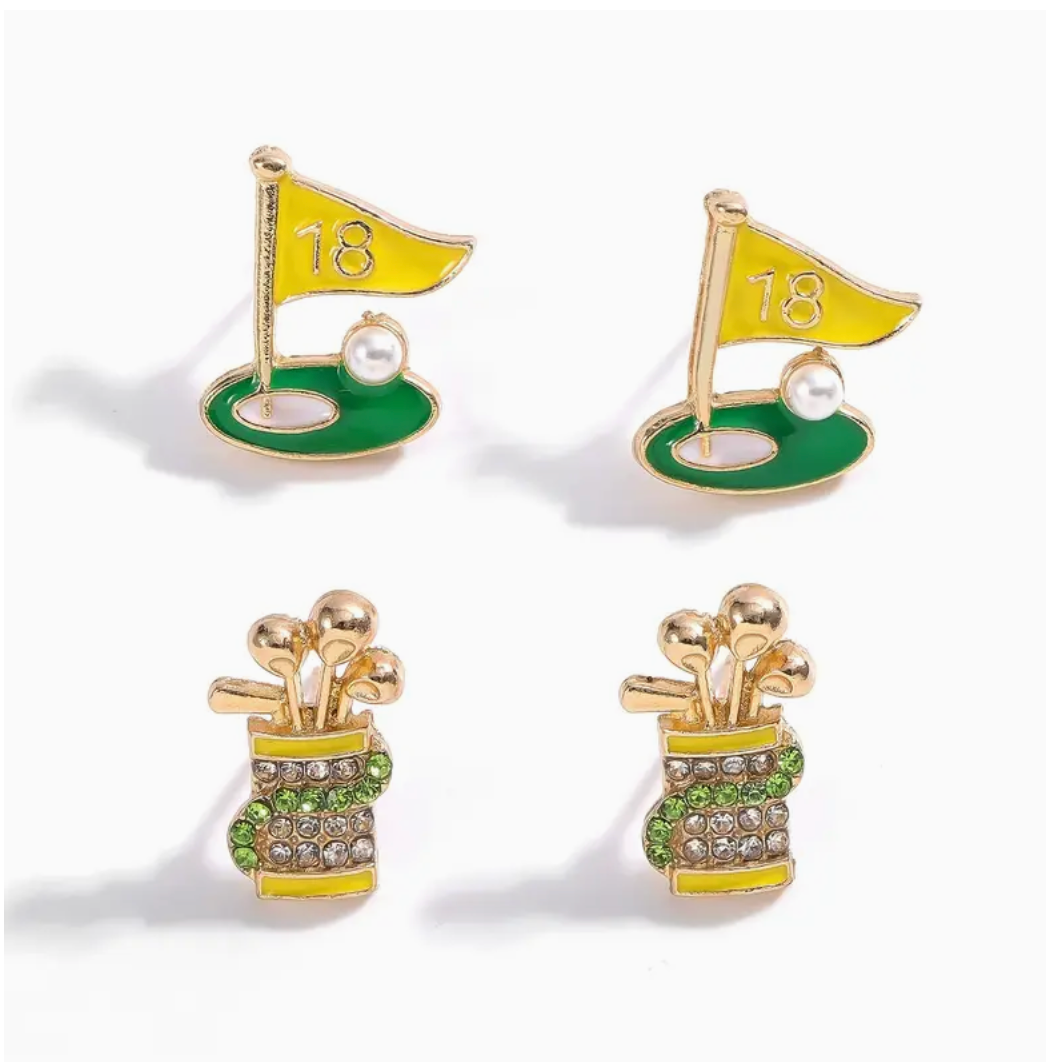 Golf-themed earrings with green grass, gold flag, and pearl on a white background