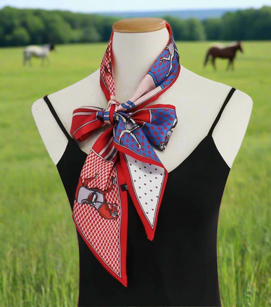 Patterned equestrian scarf draped over a mannequin wearing a black top.